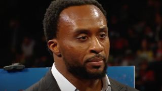 Big E looking heartbroken while The New Day yells at him